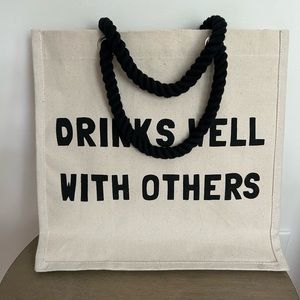 DRINKS WELL WITH OTHERS canvas tote.
